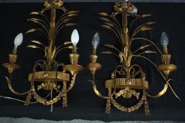 A pair of gilt metal and gesso wall mounted candelabras. L.64cm. (each)
