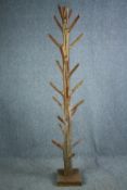 An Eastern hardwood full height coatstand. H.205cm.