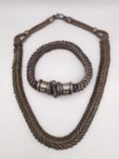 A traditional Indian silver spiral chain link rope necklace and matching bracelet. The bracelet
