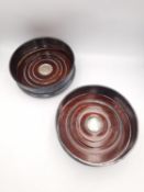 A pair of 20th century silver and oak wine coasters by Richard Carr. Hallmarked:RC, Sheffield, 1997.