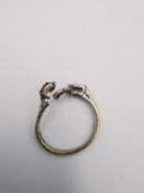 An 18ct yellow gold ring shank. Hallmarked: 18ct,750. (Stones have been removed and top is damaged).