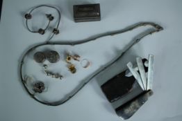 A collection of jewellery, trinket box and a pipe cleaner with initials carved into the handle.