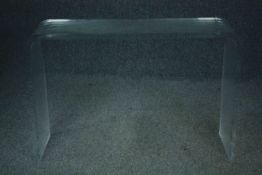 A contemporary lucite console table. H.73 W.108 D.32cm.