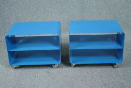 A pair of contemporary vintage industrial style side tables on casters. H.46 W.60 D.40cm. (each)