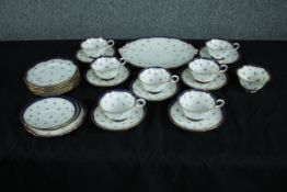 Cauldon tea set. Incomplete. Made up of eight cups and saucers, eight side plates, two saucers, a