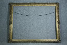 A very large giltwood and gesso frame. H.254 W.190 cm.