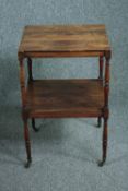Lamp table, 19th century with two tiers on casters. H.75 W.45 D.40cm.
