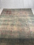 A hand woven Persian carpet. Faded. L.314 W.273cm.