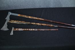 Three ceremonial Slovakian axes with etched handles and blades and spiked tips. One from the Forum