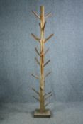A hall coat and hatstand cut from a hardwood branch. Lacquered finish. H.202cm.