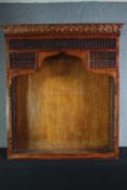 A North African style carved hardwood bookcase section. H.137 W.121 D.38cm.