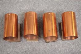 Four vintage brass and copper wall mounted downlights. L.23 Dia.13 cm. (each)