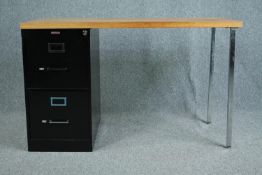 A vintage oak topped desk with filing cabinet pedestal and maker's label. H.75 W.122 D.61cm.