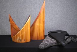 A collection of three Pan pipes. Two are cased. Twentieth century. H.76 W.46cm. (largest)
