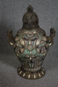 A Moroccan lidded twin handled ceramic urn with metal handles and base. Hand painted ceramic