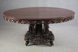 Breakfast or dining table, late 19th century or early 20th, Burmese profusely carved hardwood with