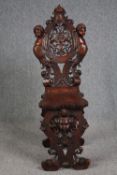 Hall chair, 19th century Italian Sgabello, carved walnut. H.117cm.