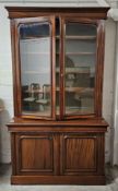 A 19th century style mahogany library bookcase, in two sections. H.223 W.130 D.60