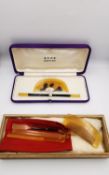 Two boxed and cased 1920s Japanese Kanzashi faux tortoiseshell and horn Kushi & Kogai sets. One with