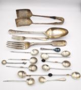 A collection of white metal and silver cutlery, including a pair of silver asparagus tongs, a