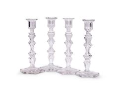 ATTRIBUTED TO BACCARAT: A SET OF FOUR CUT GLASS CANDLESTICKS