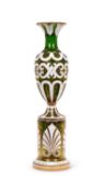A LARGE 19TH CENTURY BOHEMIAN WHITE OVERLAY GREEN GLASS VASE ON STAND