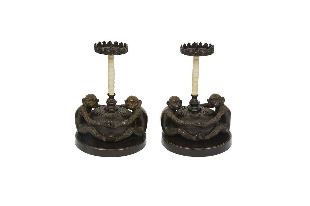 A PAIR OF MID 20TH CENTURY BRONZE AND CAMEL BONE MONKEY CANDLESTICKS - Image 1 of 3