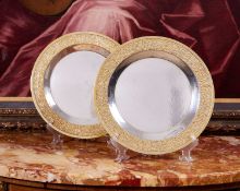 STUART DEVLIN: A PAIR OF STERLING SILVER AND PARCEL GILT MODERNIST PLATES, 1968