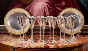 STUART DEVLIN: A SET OF TWELVE STERLING SILVER AND PARCEL GILT MODERNIST CHAMPAGNE FLUTES