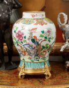 AN 18TH CENTURY CHINESE PORCELAIN VASE WITH FRENCH ORMOLU MOUNTS