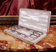 HERMES: A SET OF TWELVE 1930'S SILVER PLATED 'HORSE BIT' MENU HOLDERS