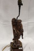 A VINTAGE CHINESE HARDWOOD CARVED ORIENTAL FIGURE ON LAMP BASE