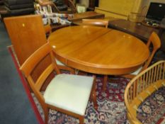 A MODERN EXTENDING DINING TABLE WITH 4 CHAIRS