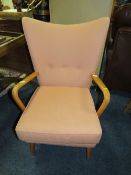 A RETRO UPHOLSTERED ARMCHAIR