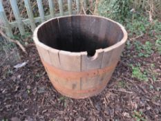 A HALF WOOD BOUND PLANTER