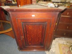 AN ANTIQUE OAK HANGING CORNER CUPBOARD