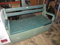 A PLASTIC GARDEN BENCH WITH LIFT-UP LID FOR STORAGE