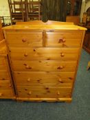 A MODERN HONEY PINE SIX DRAWER CHEST W- 82 CM