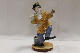 A ROYAL DOULTON FIGURINE 'THE CLOWN' HN 2890 A/F Finger missing