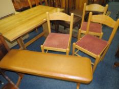 A KITCHEN TRESTLE TABLE WITH BENCH SEAT AND THREE CHAIRS