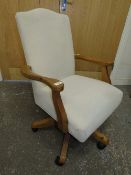 A MODERN DUCAL PINE UPHOLSTERED SWIVEL OFFICE CHAIR
