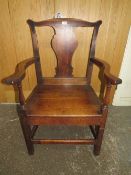 AN ANTIQUE OAK LARGE OPEN ARMCHAIR