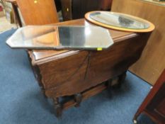 AN OAK BARLEYTWIST DROPLEAF TABLE AND TWO HANGING MIRRORS (3)