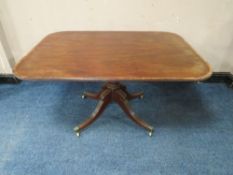 A GEORGIAN MAHOGANY SHAPED RECTANGULAR BREAKFAST TABLE, the top with crossbanded rosewood banding,