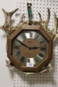 AN ANTLER MOUNTED WALL CLOCK DISPLAY