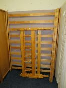 A MODERN HONEY PINE DOUBLE BED FRAME