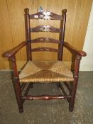 AN ANTIQUE OAK WICKERSEAT ARMCHAIR