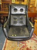 A RETRO BLACK SWIVEL CHAIR