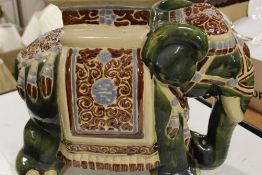 A LARGE CERAMIC ELEPHANT PLANT STAND