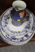 A FLORAL ROYAL DOULTON JUG TOGETHER WITH FOUR BLUE AND WHITE PLATTERS